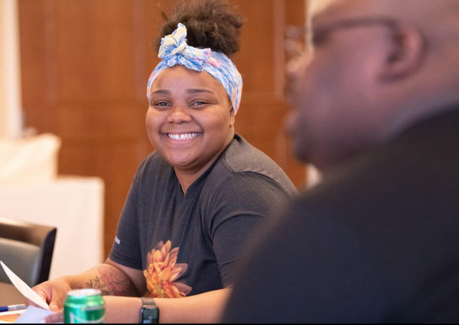 a staff member of the waters smiling