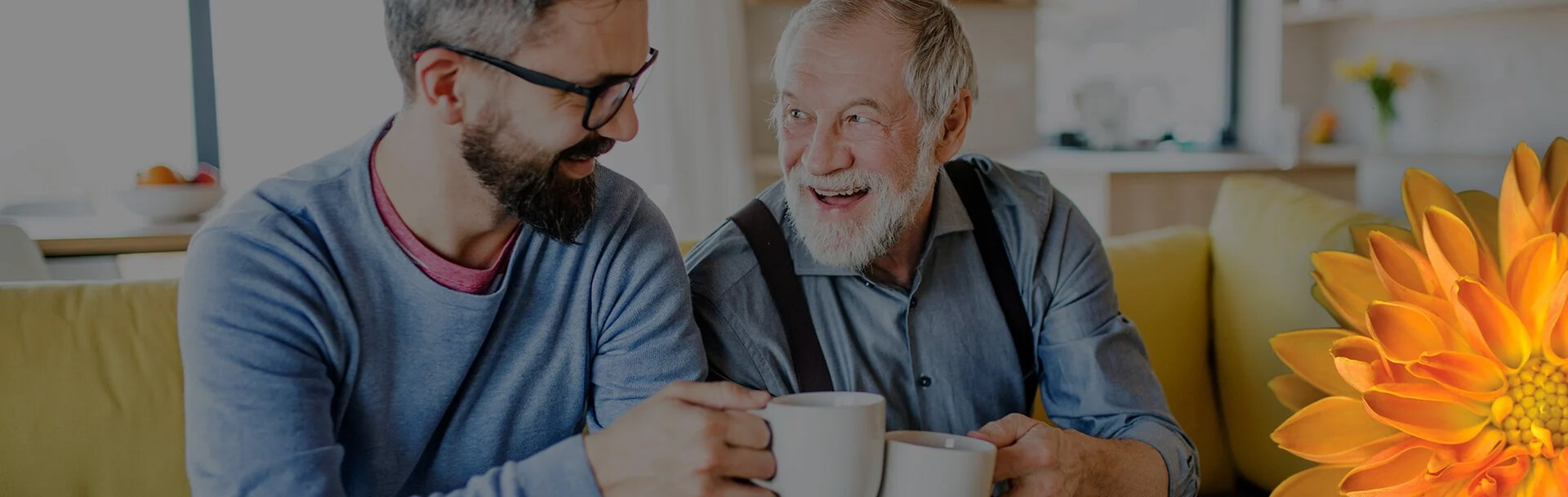 a man and an elderly man doing a cheers with coffee and smiling