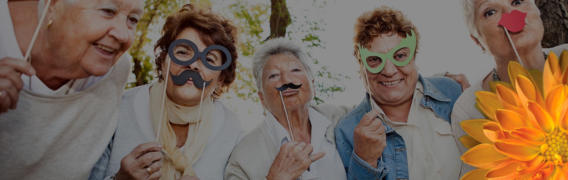 a group of older folks using props to have fun