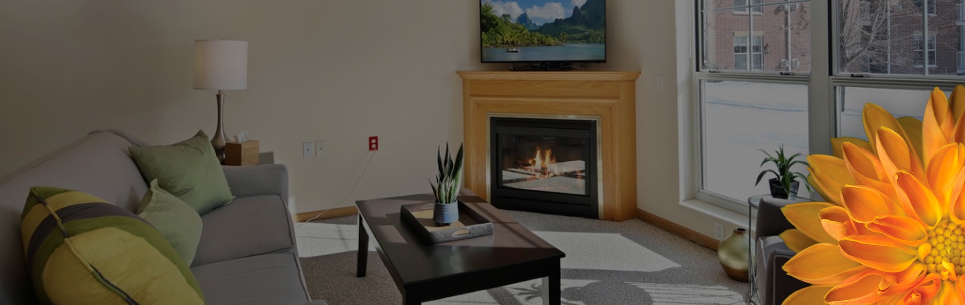 an apartment living room with a fireplace lit