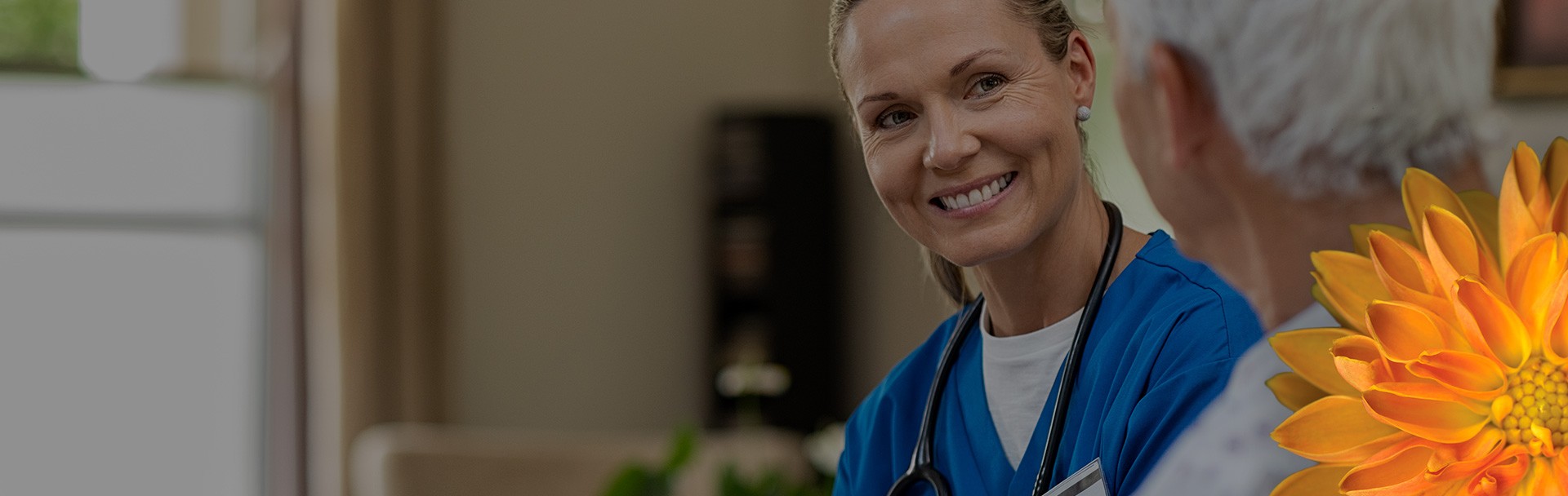 a medical professional smiling with her patient