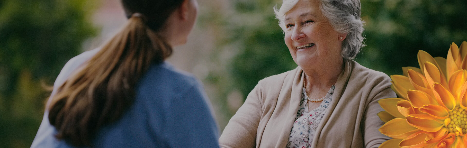 a woman making an elderly woman smile