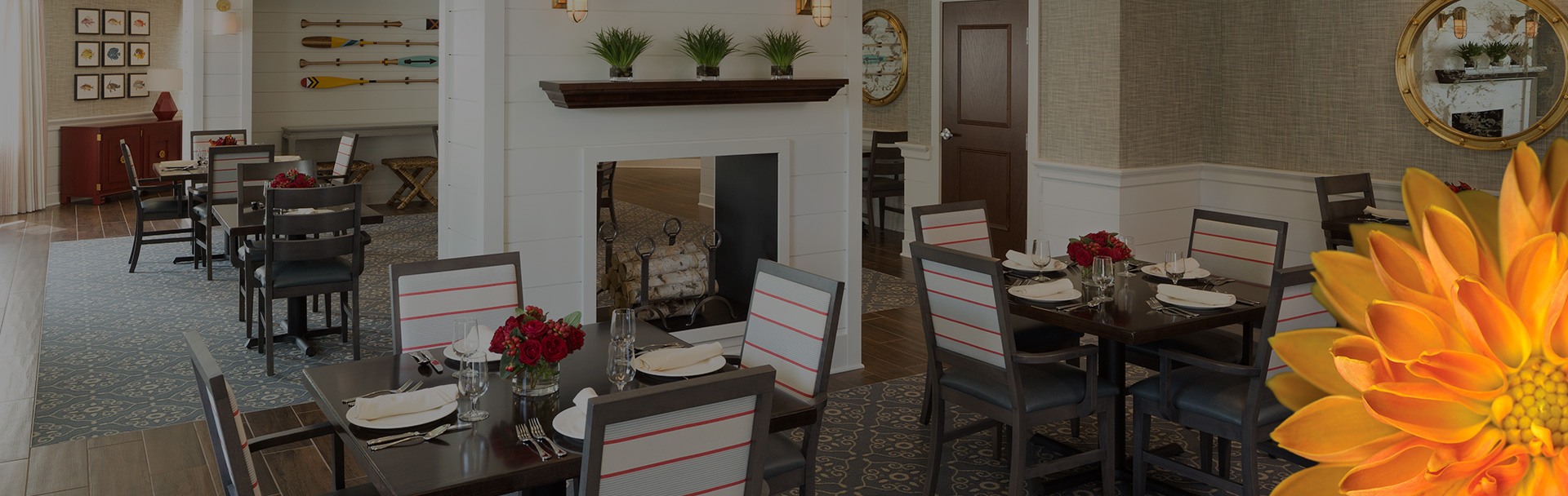 Dining room with many tables and chairs sitting around the room.