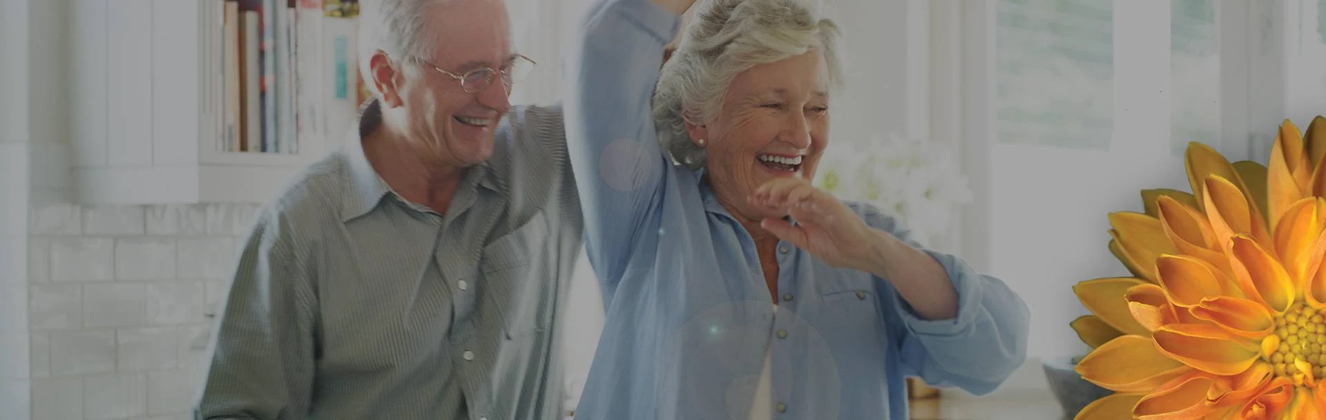 two seniors dancing and smiling