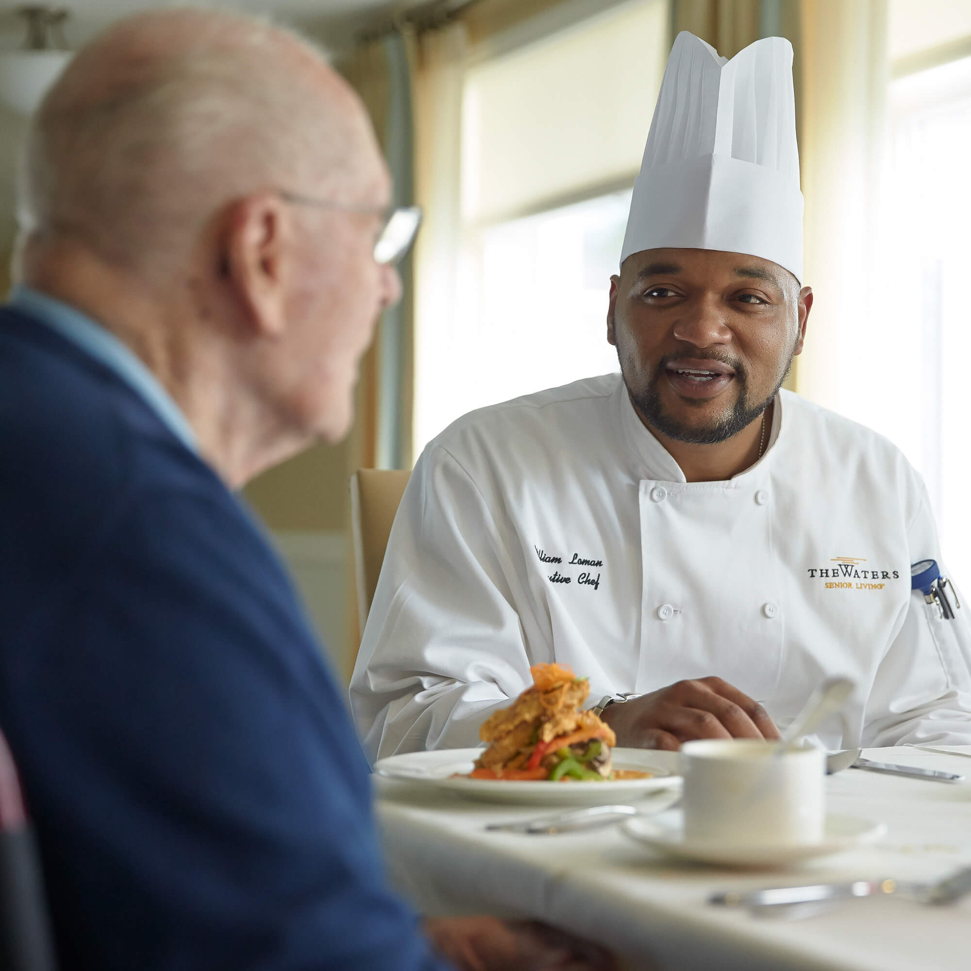 the chef talking to a resident