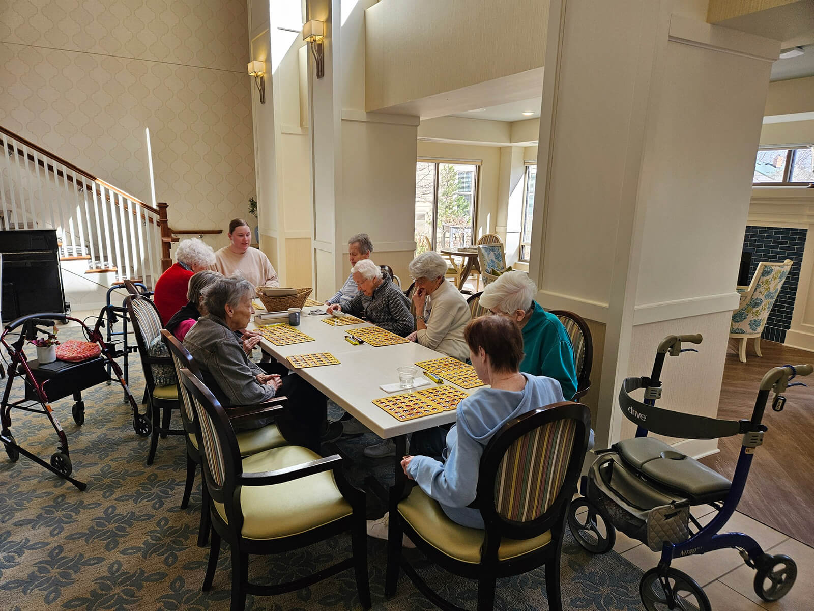 Elderly residents playing bingo in a social activity room at Highland Park.