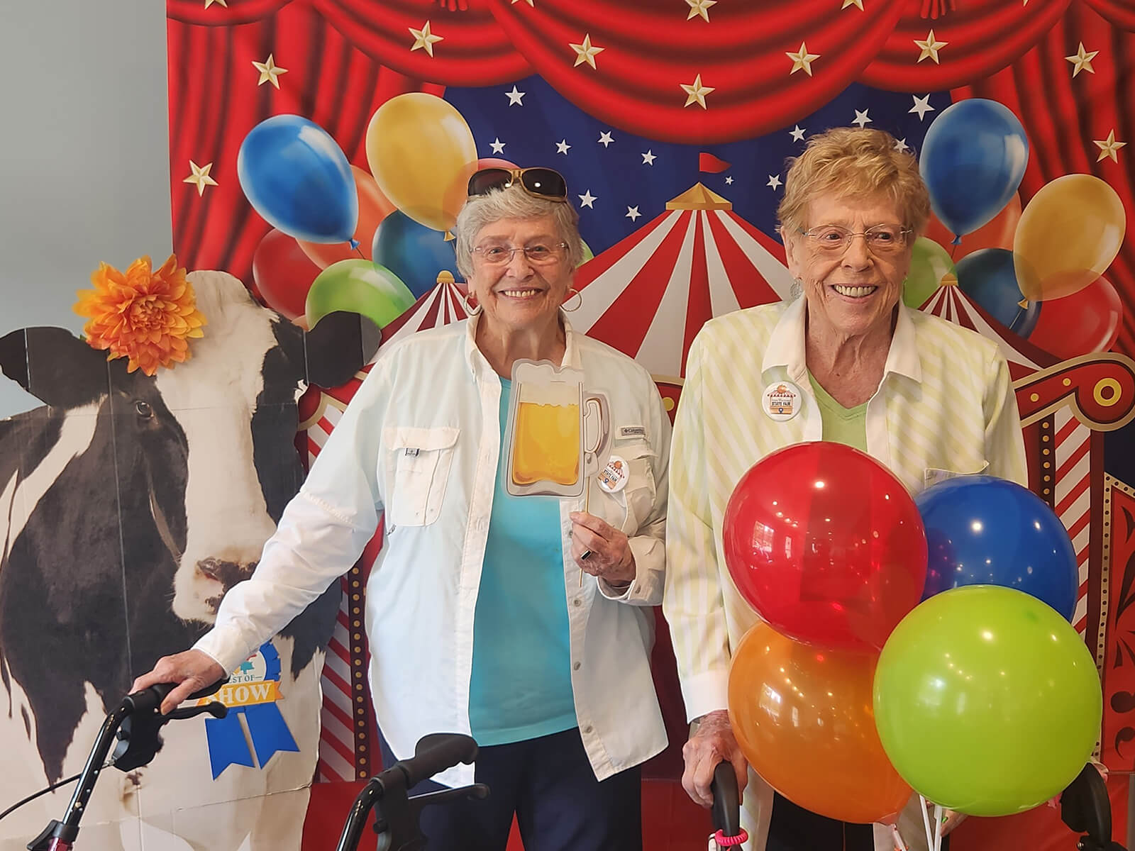 Seniors at The Waters of Excelsior having fun during a carnival-themed day with festive decorations and activities, enhancing community joy.