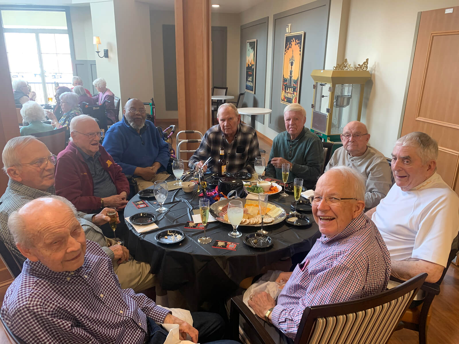 Group of senior gentlemen enjoying a social hour at The Waters of Plymouth.