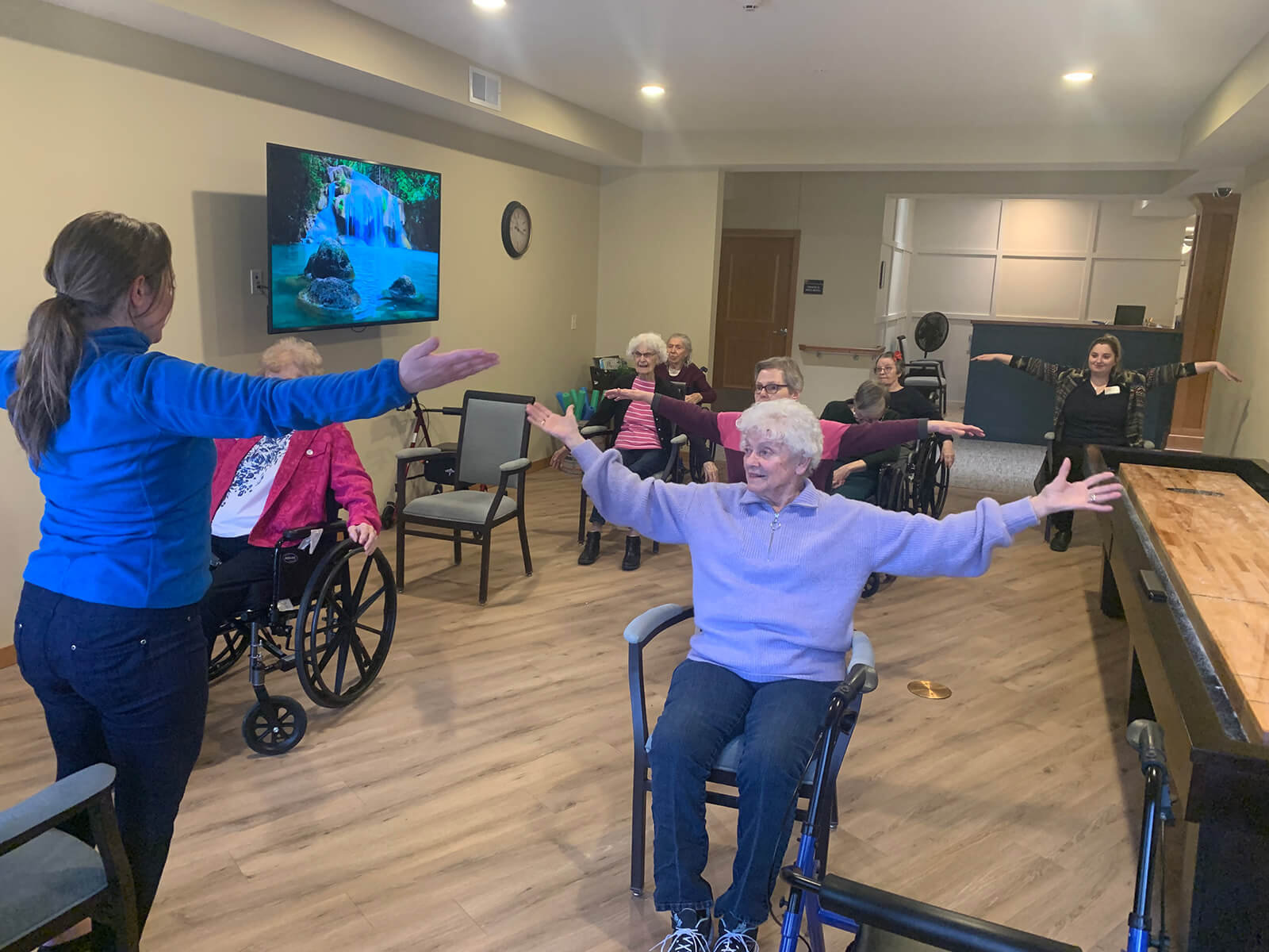 Residents at The Waters of Plymouth during a group physical therapy session.
