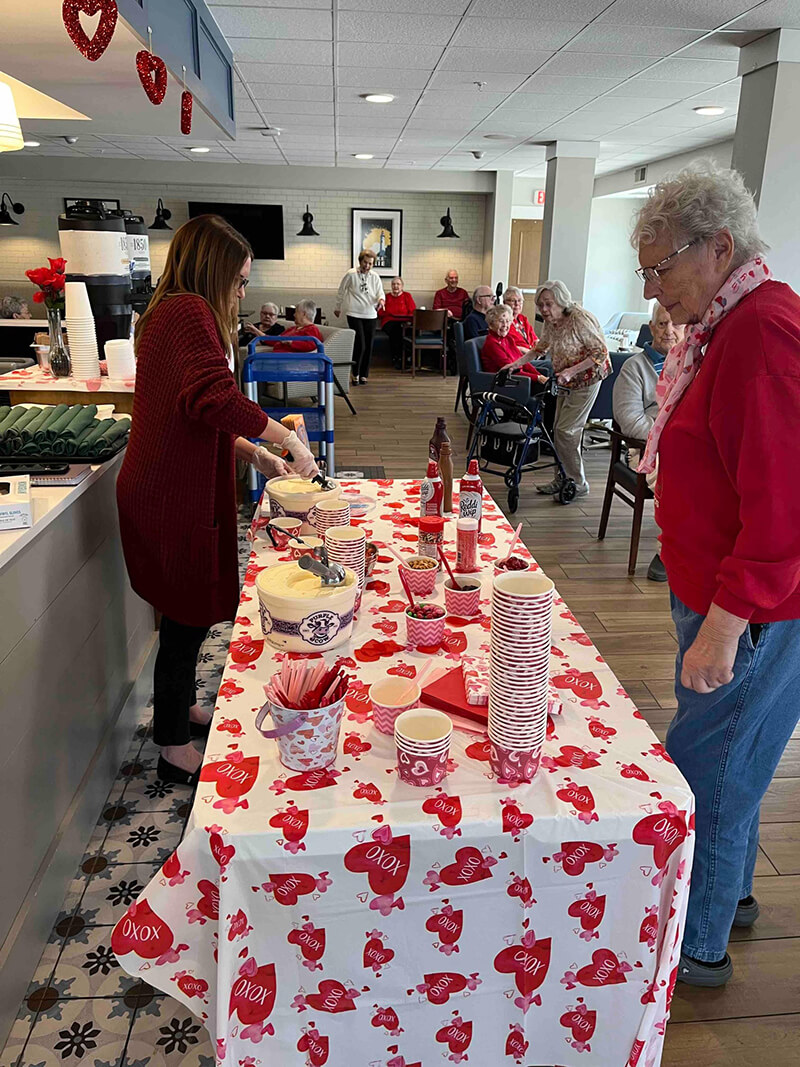 Senior residents partaking in an ice cream social at The Waters of Oak Creek.