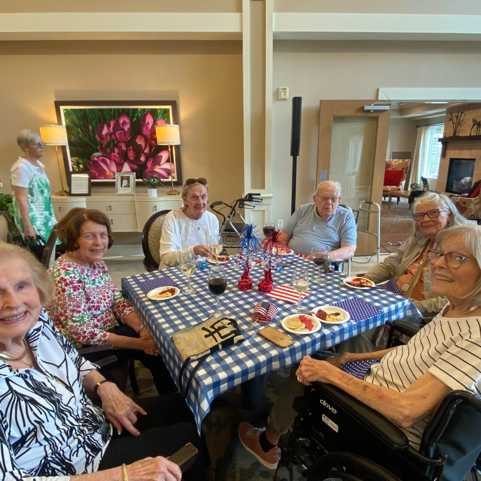 Seniors at The Waters on 50th in Minneapolis celebrating an American holiday with a festive table setting and a patriotic theme.