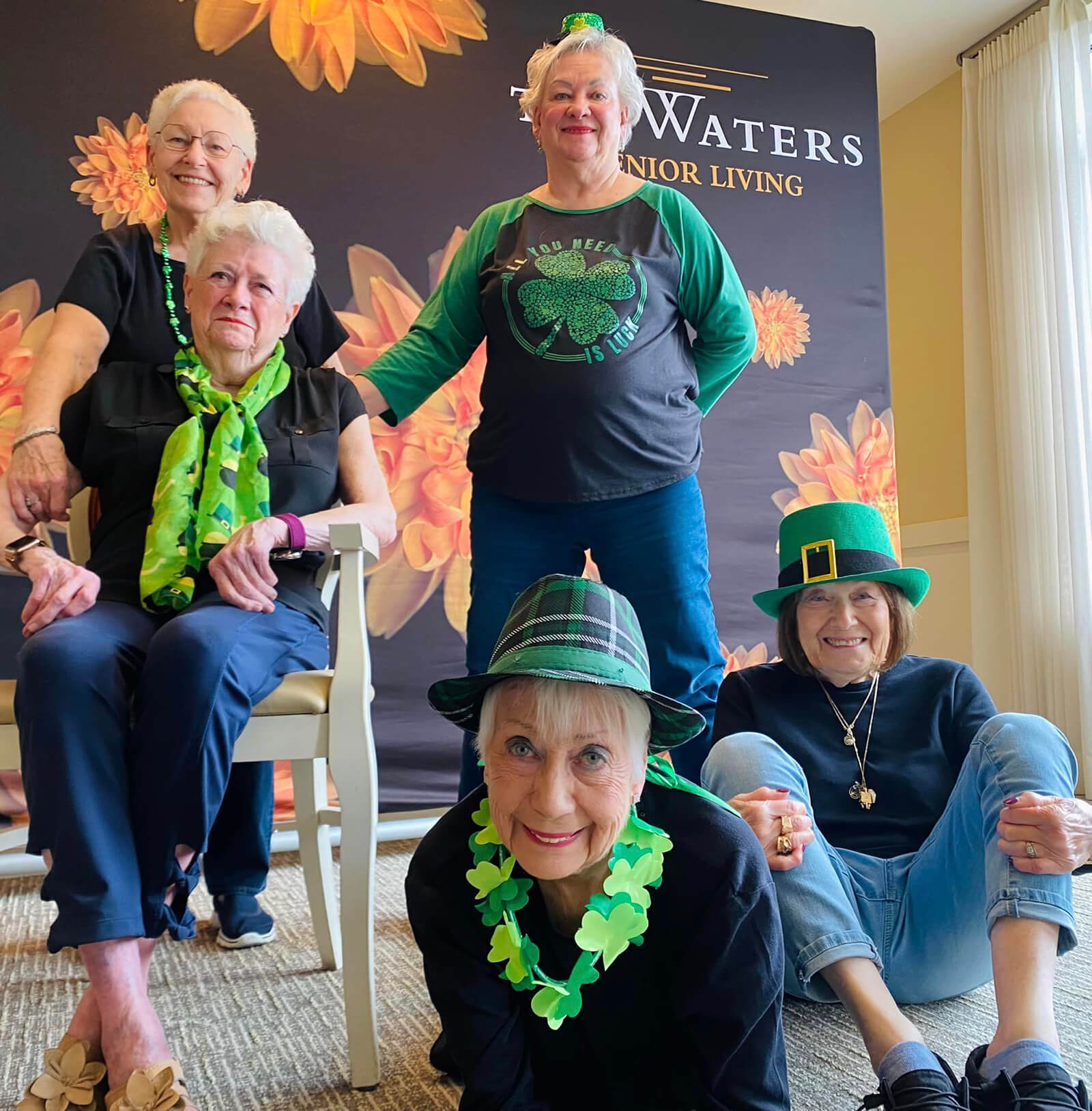Residents of The Waters on Mayowood celebrating St. Patrick's Day with festive attire, reflecting the community's lively event calendar.