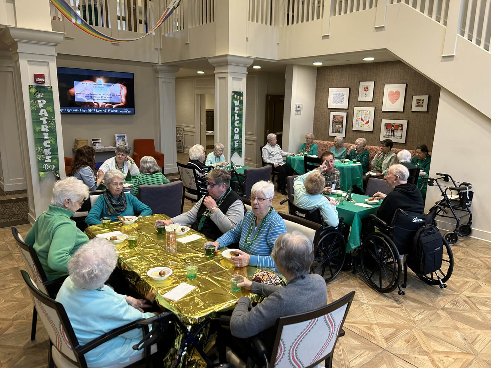 Seniors at The Waters of Wexford celebrating St. Patrick’s Day with a festive meal, highlighting cultural festivities.