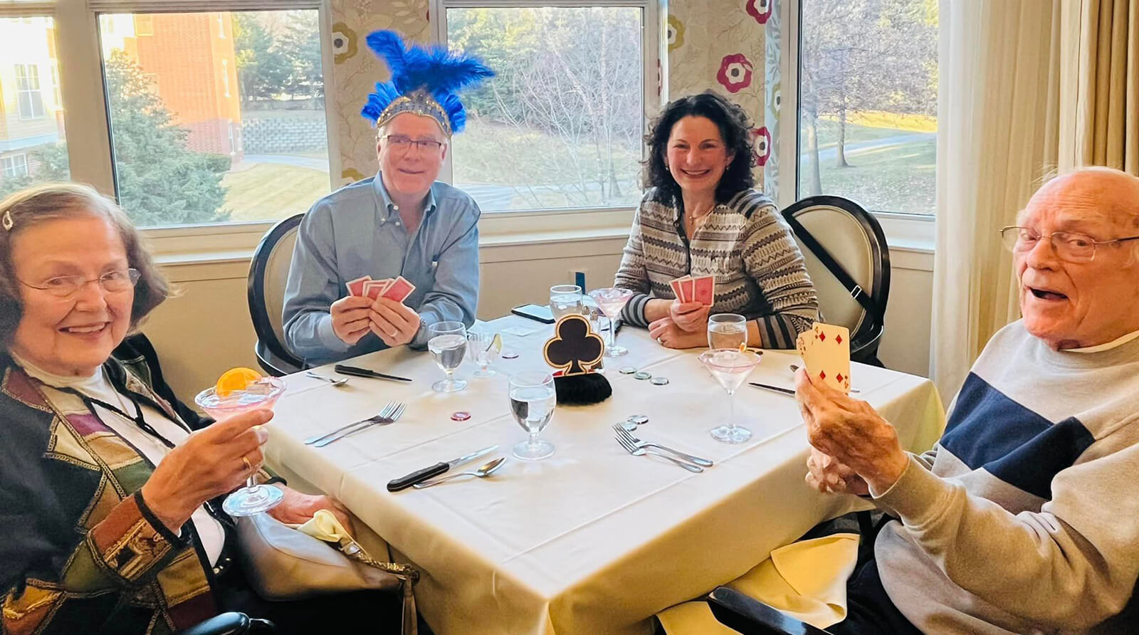 Residents playing cards at The Waters of Eden Prairie senior living community.