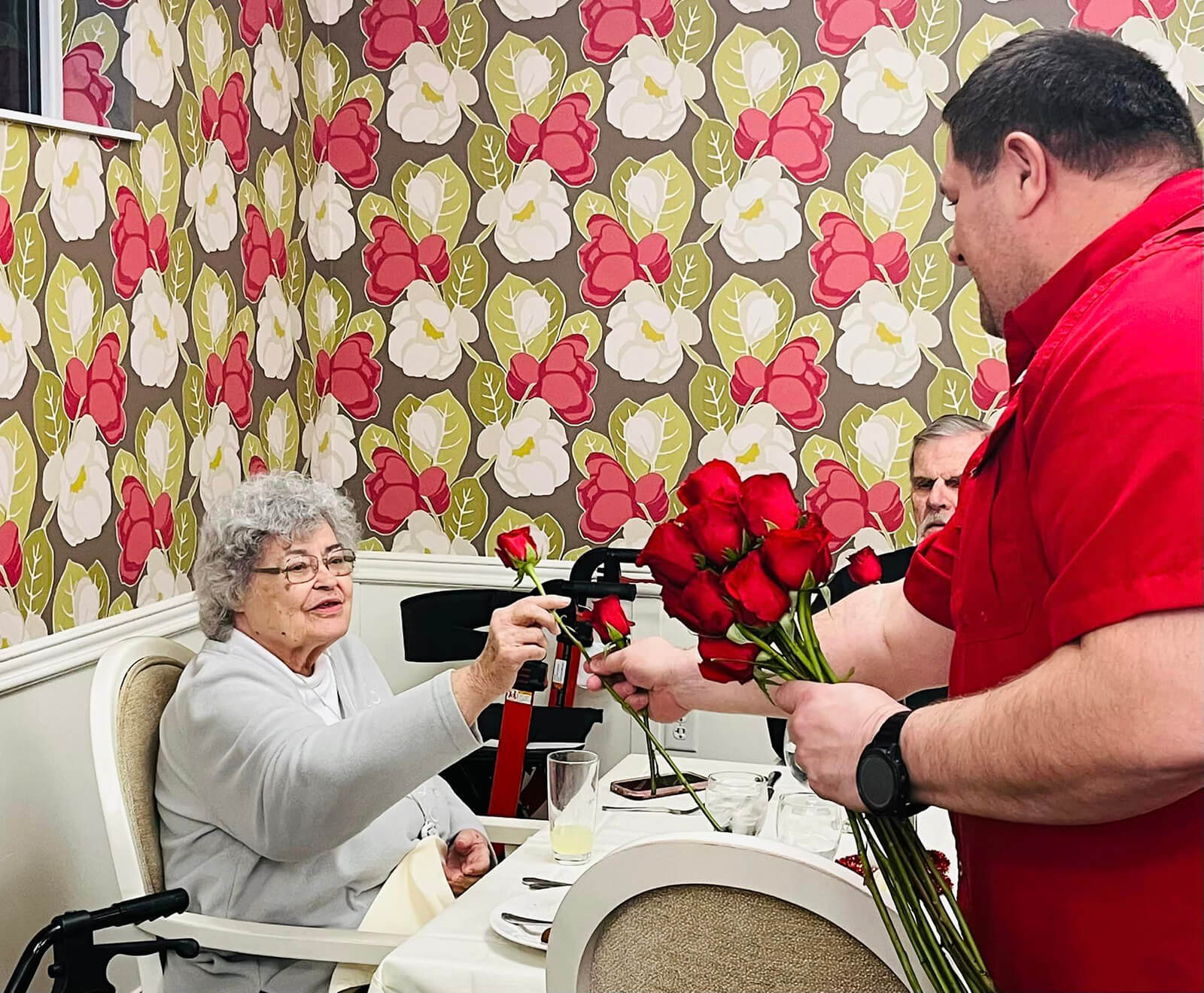 Elderly residents enjoying a flower arrangement workshop at The Waters of Eden Prairie.